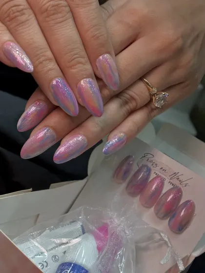 Showing the client's finished look alongside the press-on nail kit, which includes everything you need for application.