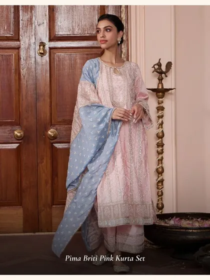 A closer look at the Pima Briti Pink Kurta Set. The dual-toned dupatta and intricate embroidery make it a unique choice for any celebration.