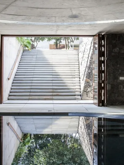 The Hamam at K-Lagoon residence is inspired by traditional Turkish baths and Indian stepwells. A grand staircase leads down into the subterranean space, reflected in the still water.