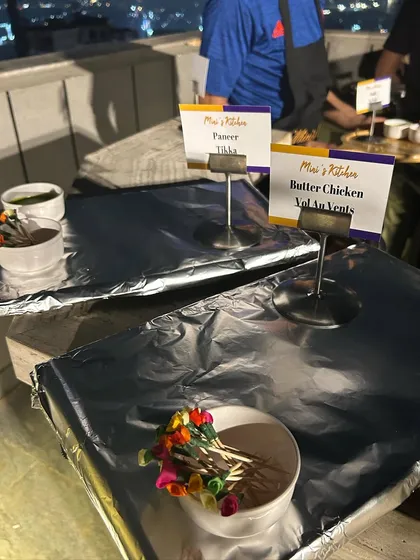 A glimpse of a terrace party I catered for Diwali. Even with simple foil covering to keep the food hot, the presentation with custom labels for Paneer Tikka and Butter Chicken Vol Au Vents adds a professional touch.