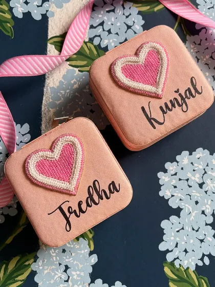 Two adorable pink jewellery boxes, personalised with the names 'Jredha' and 'Kunjal'. These compact travel cases are a wonderful gift for bridesmaids or for a birthday.