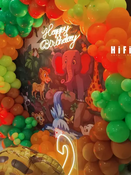 A close-up of the jungle theme backdrop and neon sign, showing the rich colors and details.