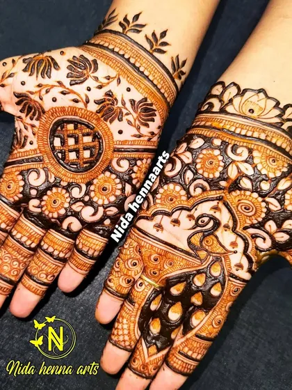 A beautiful design created for the Teej festival. It features a peacock on one hand and a floral mandala on the other, blending traditional motifs in a unique way.