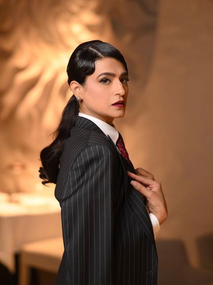 A final portrait from the "old money" shoot, her direct gaze and flawless makeup exuding power and elegance.