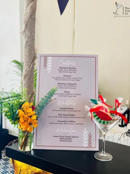 A beautifully styled bar menu for a brunch event. The menu is complemented by a martini glass filled with our molecular cocktail jellies, showcasing our creative offerings.