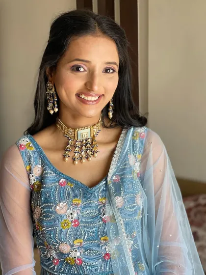 A portrait of the Roka bride, her hairstyle simple and elegant.