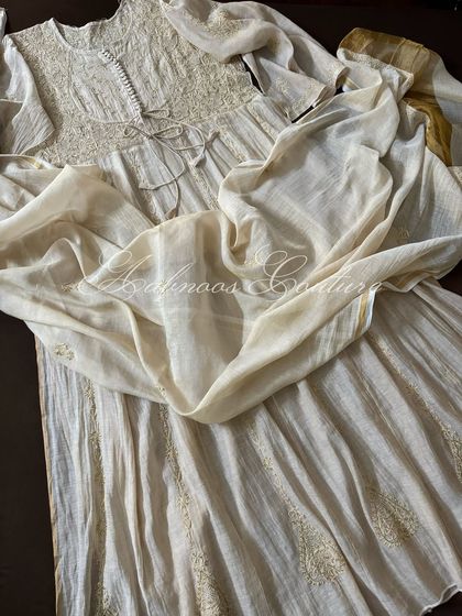 A view of the Anarkali's full flare, showing the subtle sheen of the Tissue Chanderi fabric.