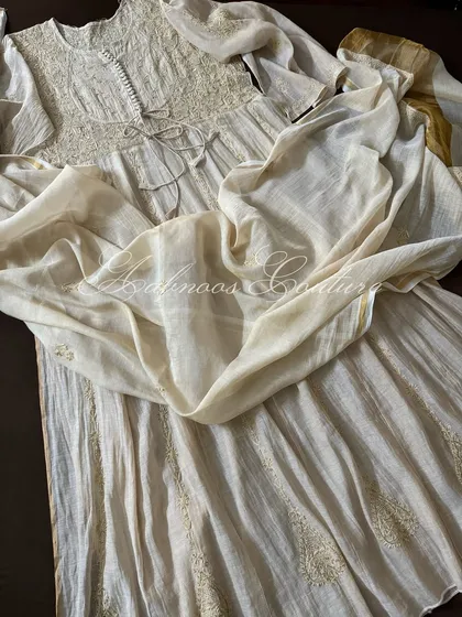 A view of the Anarkali's full flare, showing the subtle sheen of the Tissue Chanderi fabric.
