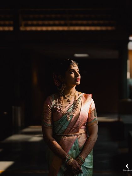 A dramatic and artistic portrait of Nidhi. The makeup holds up beautifully even in strong, directional lighting.