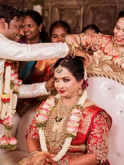 A beautiful ritual during Dr. Jyothi's Muhurtham. Her makeup was designed to be long-lasting and radiant, ensuring she looked perfect throughout all the wedding ceremonies.