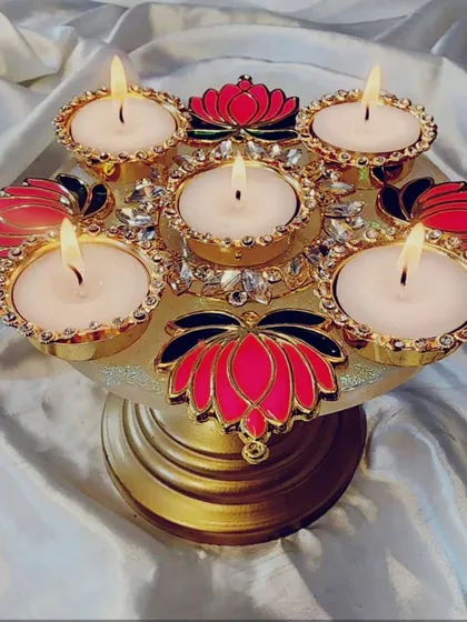 My new Diwali edit. This multi-level resin tealight candle holder with lotus details is a true centerpiece.