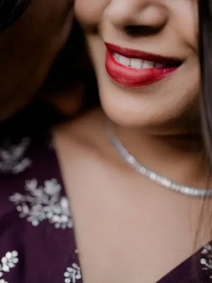 An extreme close-up focusing on the bride's bright, happy smile. This shot is all about capturing pure joy and the small details that make a moment special.