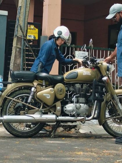 A student getting familiar with the bike's controls. This foundational knowledge is crucial for building the confidence needed to handle a Royal Enfield.