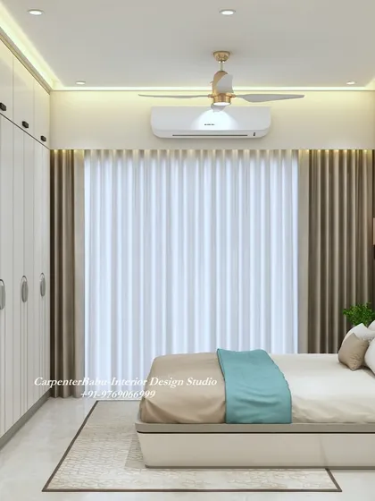 A simple and elegant bedroom with a full-wall wardrobe and a large window that lets in plenty of natural light. The turquoise headboard adds a refreshing pop of color.