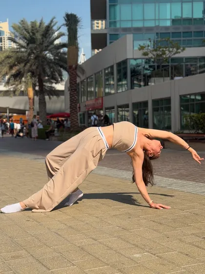 A full wheel pose on the Dubai waterfront. My travels are always an opportunity to mix my love for dance, fitness, and exploring new places.