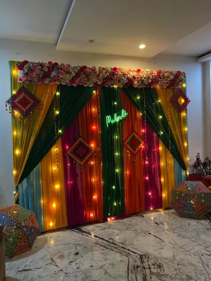 The same Mehndi backdrop in slightly different lighting, showing its versatility.