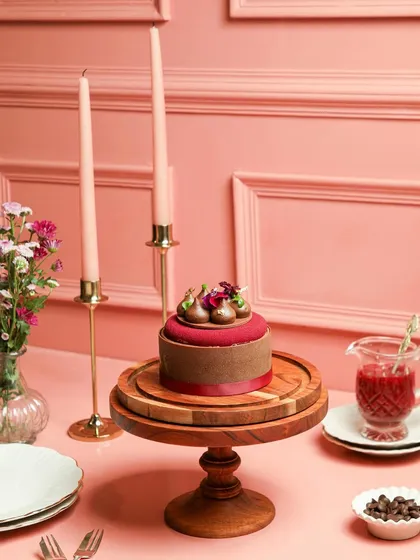 A wider view of our Chocolate Strawberry Entremet, set on a festive table. A dessert you won't be able to get enough of.