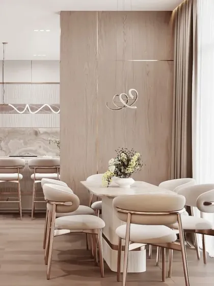 An integrated living and dining space with a consistent design language. The light wood tones and neutral palette create a harmonious and calming atmosphere throughout the home.