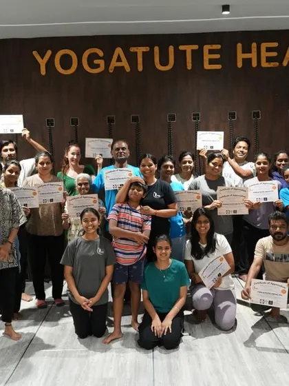 The happy and relaxed group at the end of our Aerial Yoga and Sound Healing workshop, holding their certificates. It is a privilege to guide students on this journey to inner peace.