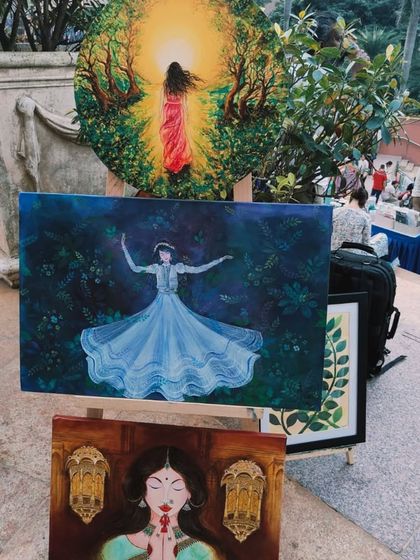 More snippets from 'Sublime Fiesta', with beautiful paintings of dancers and spiritual figures displayed outdoors.