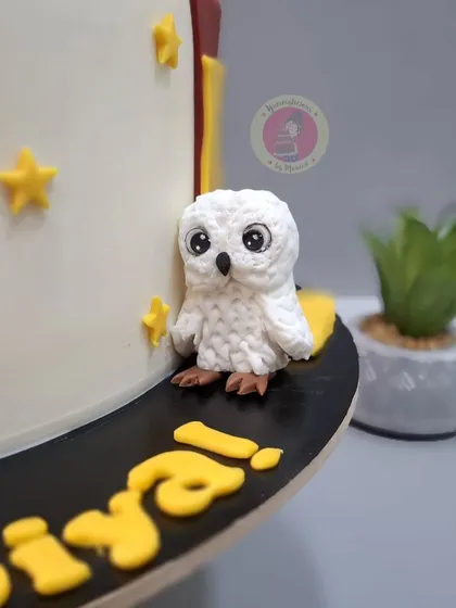 A close-up of a tiny, adorable Hedwig figurine from one of our Harry Potter themed cakes. Even the smallest elements are crafted with love and precision.