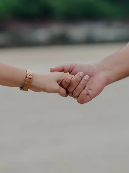 A close-up of the couple holding hands. This simple gesture, captured during their pre-wedding shoot, speaks volumes about their bond and the journey they are on together.