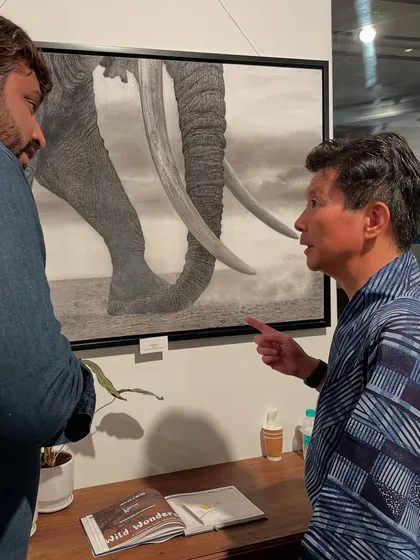 In conversation with the Consul-General of Japan at the Bajaj Art Gallery in Mumbai, discussing the details of my elephant artwork.