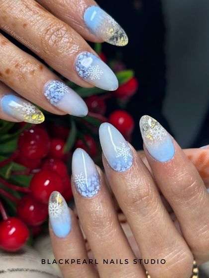 Another view of the winter-themed nails, showing the intricate built-in effects that make this design pop. It’s a perfect look for the holiday season or a winter celebration.