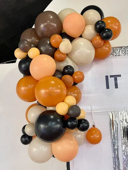 A detailed look at the balloon garland from 'The Office' party. We intentionally chose a subdued color palette to match the show's aesthetic, proving that great design is about making the right choices for the theme.