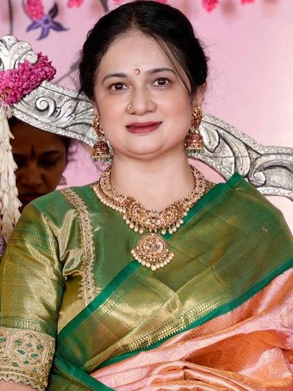 Another beautiful shot of Vani Reddy at a wedding, her smile as radiant as her silk saree.
