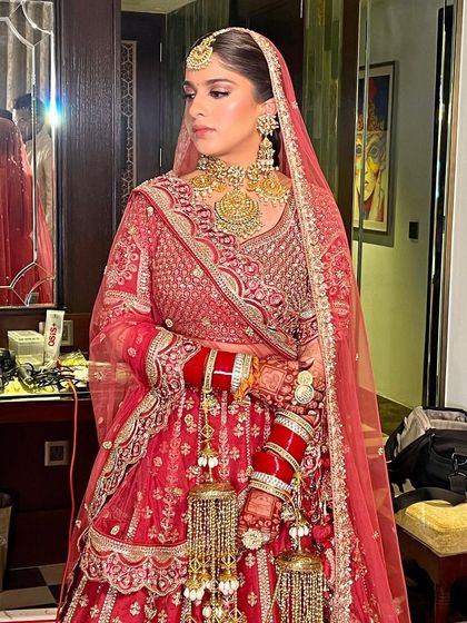 The bride looks fresh and radiant for her morning wedding, her hair neatly braided and styled.