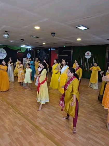 A wide shot of the class in motion. You can see the coordinated movements and the sheer scale of the energy in the room. This is what a BollyBeats session feels like.