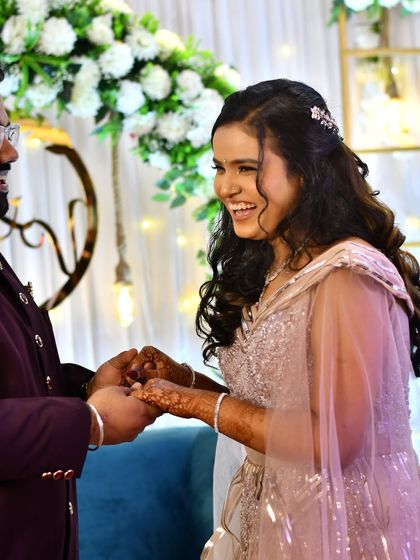 Holding hands, ready for forever. This candid shot shows how her natural makeup look was perfect for capturing the genuine emotions of the day.