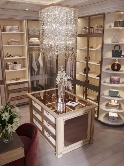A different view of the crystal chandelier closet, showing the vanity nook with a lily bouquet and the detailed craftsmanship of the central island.