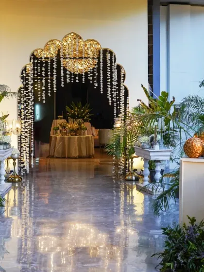 The entrance sets the tone for any event. Here, we designed a grand archway draped in delicate strings of mogra flowers, leading guests into an elegant reception space and creating a breathtaking first impression.