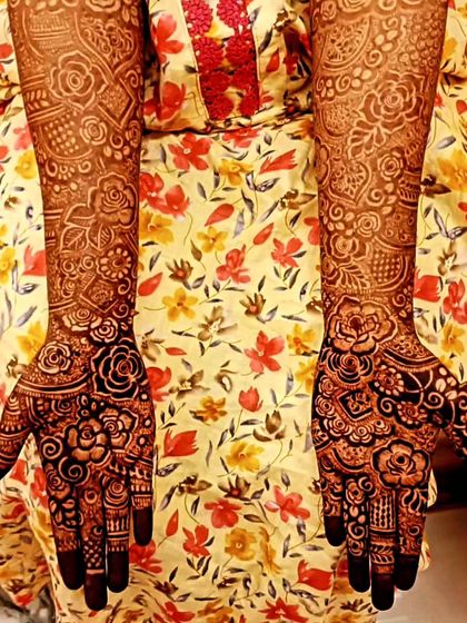 The beautiful, dark stain of two different bridal designs, showcasing the quality of my organic henna.