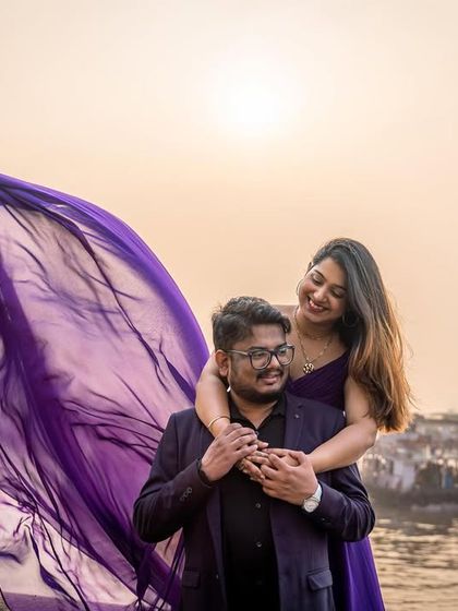 A sweet embrace with the city's heartbeat in the background. The flowing purple gown adds a touch of drama and elegance to this romantic pre-wedding shoot in Mumbai.
