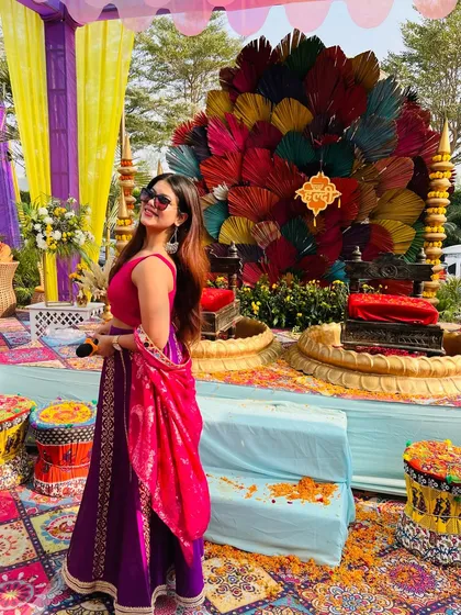Posing with the mic before the Haldi function begins. The calm before the storm of fun and games.