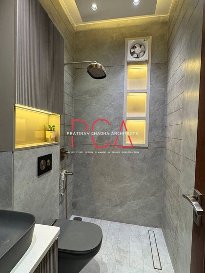 A duplicate of image 117, providing another clear view of the well-lit and elegantly designed modern bathroom.