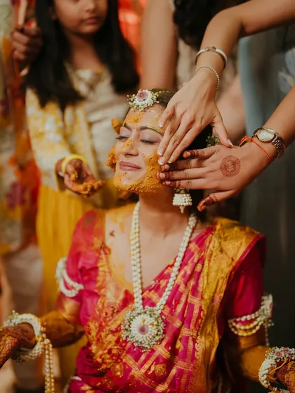 The bride glows as she is blessed with haldi by her loved ones. We manage the event flow so you can soak in these precious, candid moments without a worry.