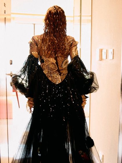 A series of images capturing the stunning Rahul Mishra Couture outfit I styled for Jonita Gandhi's performance. The detailed embroidery, flowing silhouette, and pairing with thigh-high Louboutin boots created a look that was both ethereal and powerful.