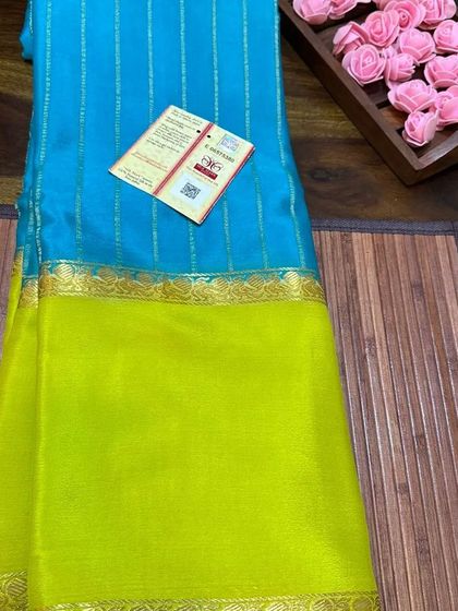 The sky blue and lime green wrinkle crepe saree, a fresh and vibrant choice.