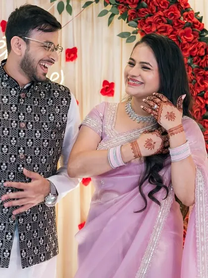 Sharing a private joke during their engagement party. We look for these natural interactions that show a couple's unique bond.