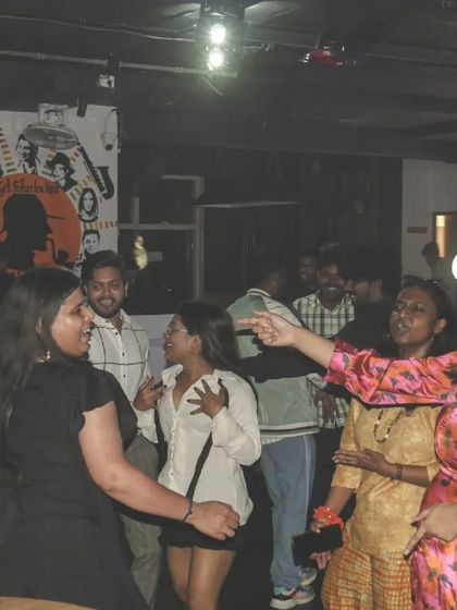 A candid shot of the dance floor, full of people laughing and dancing together. It's a beautiful chaos.