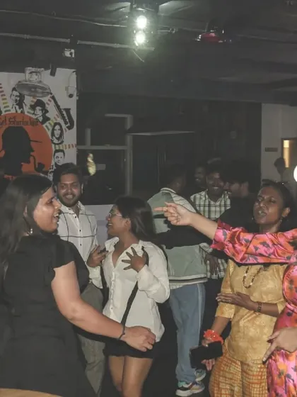 A candid shot of the dance floor, full of people laughing and dancing together. It's a beautiful chaos.