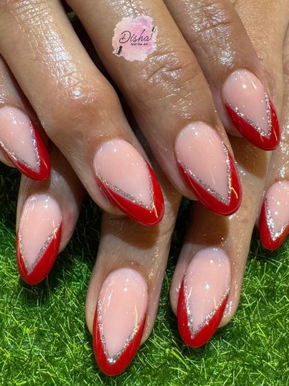 Special Christmas nails for a special occasion. This design features a classic red French tip with a delicate silver glitter line for a festive touch.