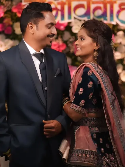 A romantic moment between the couple, their eyes locked in a loving gaze.