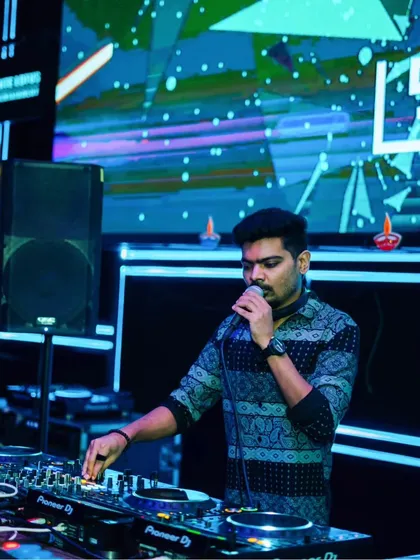 On the mic during a Diwali themed night. I love to engage with the audience and explain the unique fusion of sounds I'm playing.