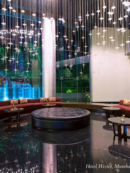The lobby of Hotel Westin, Mumbai, showcases modern luxury with its high ceilings and dramatic lighting. A great choice for a contemporary city wedding.