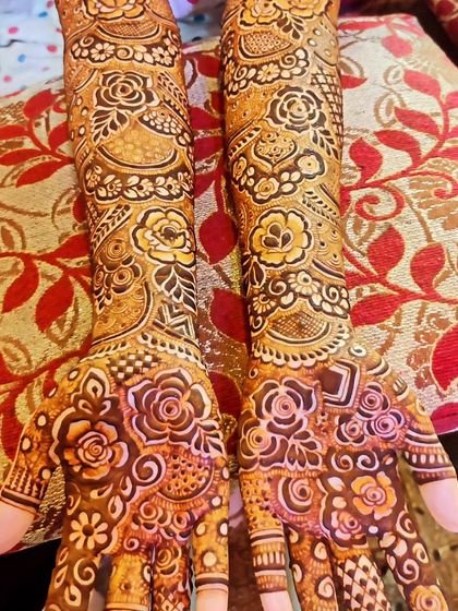 Saniya's beautiful bridal mehndi, showcasing the intricate patterns on her hands from different angles.